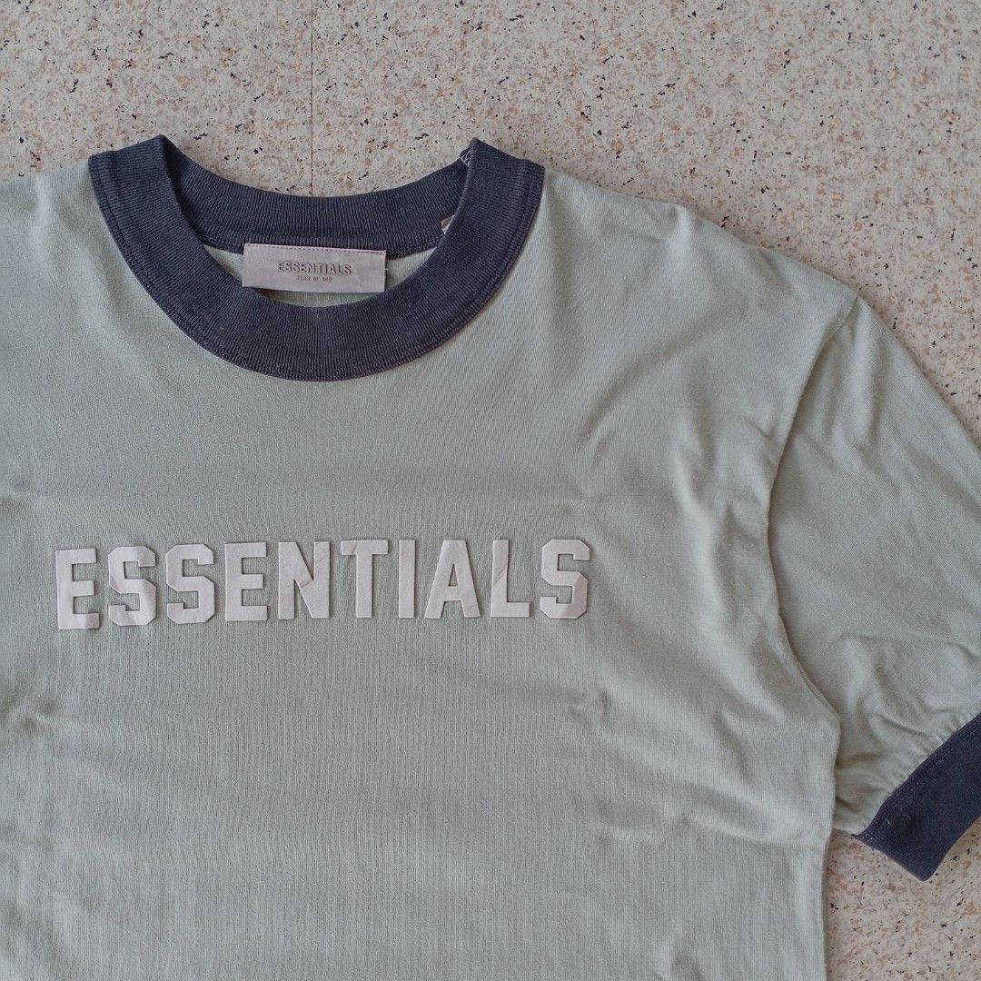 Essentials Fear of God Ringer Tee (Category: Tshirts & Polo Shirts ) located in Maramag. Submitted by kenthrift_ (Listing ID 1450358835, Image 2). Description: Essentials Fear of God Ringer Tee •Very good condition •Size On Tag: 14/18 •Measurements: Width 21 & Length 27 •Collar and sleeves color rate 8.5/10.