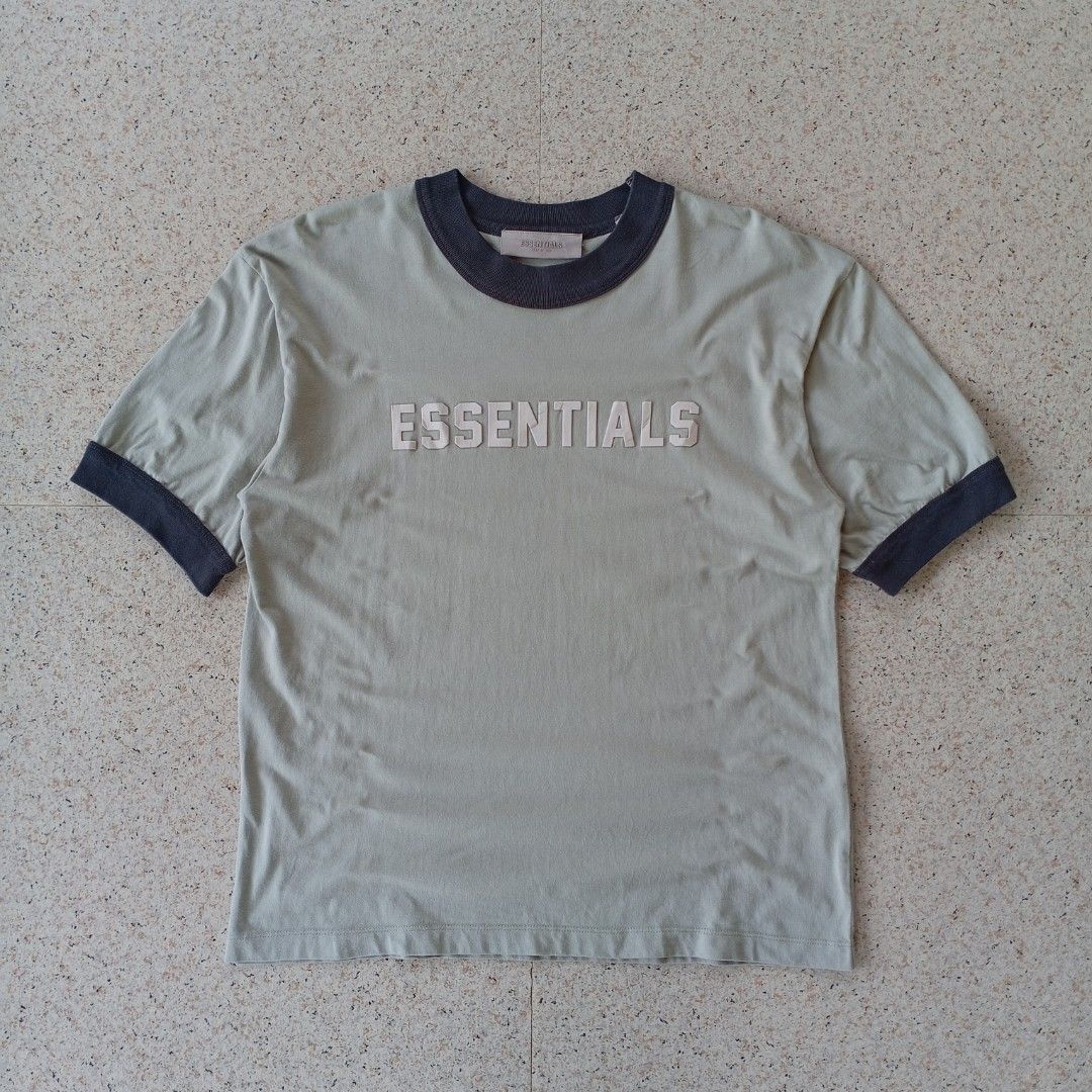 Essentials Fear of God Ringer Tee (Category: Tshirts & Polo Shirts ) located in Maramag. Submitted by kenthrift_ (Listing ID 1450358835, Image 1). Description: Essentials Fear of God Ringer Tee •Very good condition •Size On Tag: 14/18 •Measurements: Width 21 & Length 27 •Collar and sleeves color rate 8.5/10.