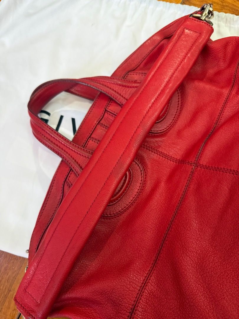 Givenchy Medium Red Leather Nightingale Bag (Category: Luxury Bags & Wallets) located in Quezon City. Submitted by bianxcloset (Listing ID 1450357056, Image 3). Description: - Authentic Givenchy Nightingale Bag - Color: Red Leather - Features iconic Givenchy logo hardware - Spacious interior with zippered pocket - Comes with original dust bag - Ideal for everyday use - Note: Shows some signs of wear on handles and leather.