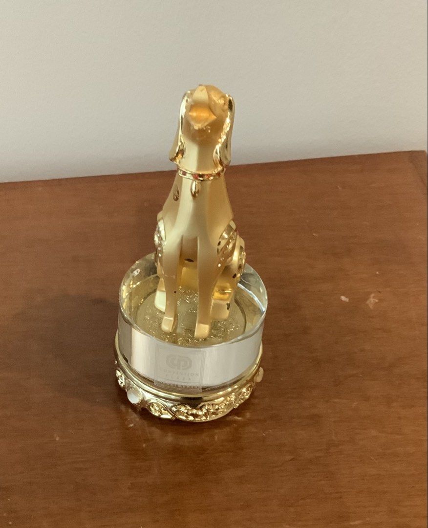 Golden Dog Figurine with Crystal Base (Category: Other Home Decor) located in Makati City. Submitted by nfb1234 (Listing ID 1450392393, Image 2). Description: - Adorable gold dog figurine - Features decorative spots and sparkly accents - Sits on a clear crystal base with writing and gold trim - Ideal for shelf or desk display - Adds charm and elegance to any space Dog figurine represents loyalty and protection RFS - declutter Packaging not origin