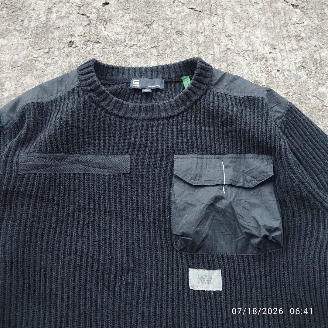 G-Star RAW Black Knit Sweater with Utility Pockets (Category: Coats, Jackets and Outerwear) located in Aguinaldo. Submitted by oddrabbit_3fd558 (Listing ID 1450320906, Image 2). Description: - Brand: G-Star RAW - Color: Black - Size: L - Material: Knit - Features: Ribbed texture, utility chest pockets, reinforced shoulder and elbow patches, thumbholes on cuffs - Style: Great for layering.