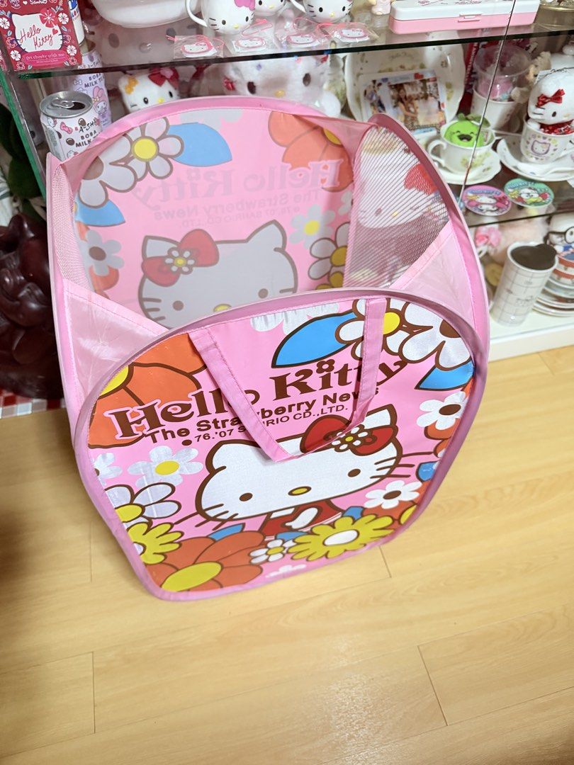 Hello Kitty Floral Collapsible Laundry Basket (Category: Laundry Baskets) located in Manila. Submitted by hellokittyjhoe (Listing ID 1450455665, Image 2). Description: - Adorable pink Kitty laundry basket - Features "The Strawberry News" design with Kitty and flowers - Collapsible for convenient storage - Mesh sides for ventilation - Sturdy handles for easy carrying - Ideal for kids' rooms or any Kitty enthusiast.