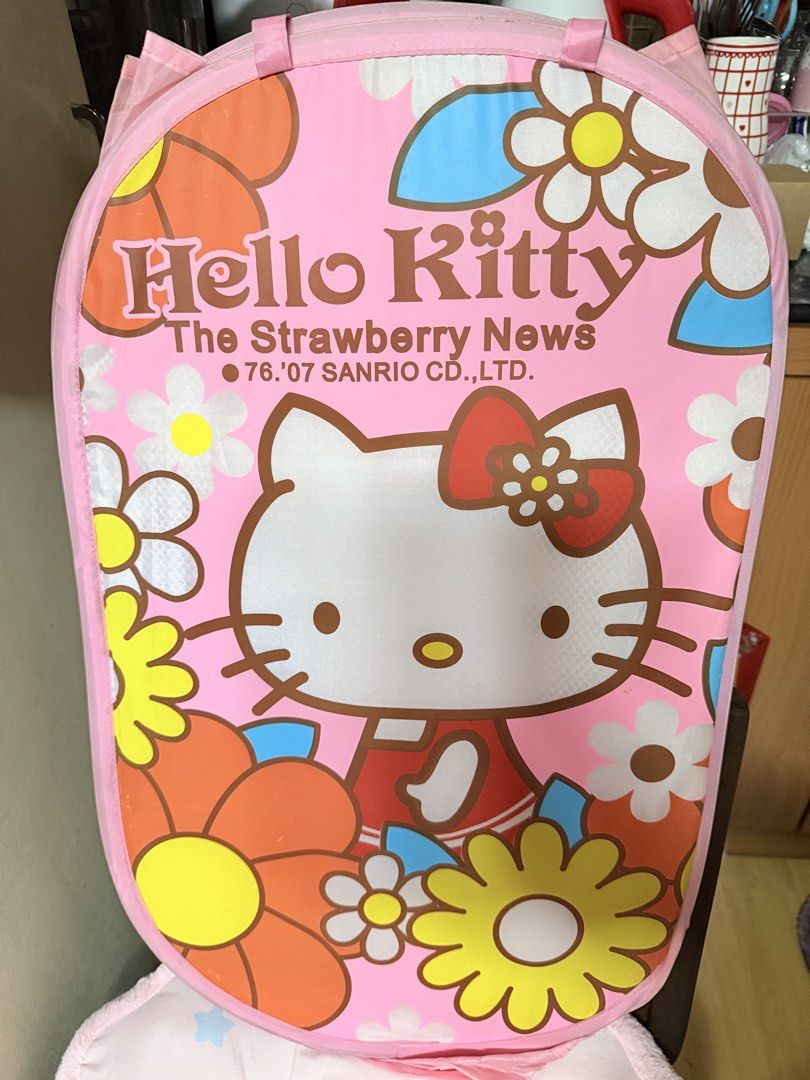 Hello Kitty Floral Collapsible Laundry Basket (Category: Laundry Baskets) located in Manila. Submitted by hellokittyjhoe (Listing ID 1450455665, Image 1). Description: - Adorable pink Kitty laundry basket - Features "The Strawberry News" design with Kitty and flowers - Collapsible for convenient storage - Mesh sides for ventilation - Sturdy handles for easy carrying - Ideal for kids' rooms or any Kitty enthusiast.