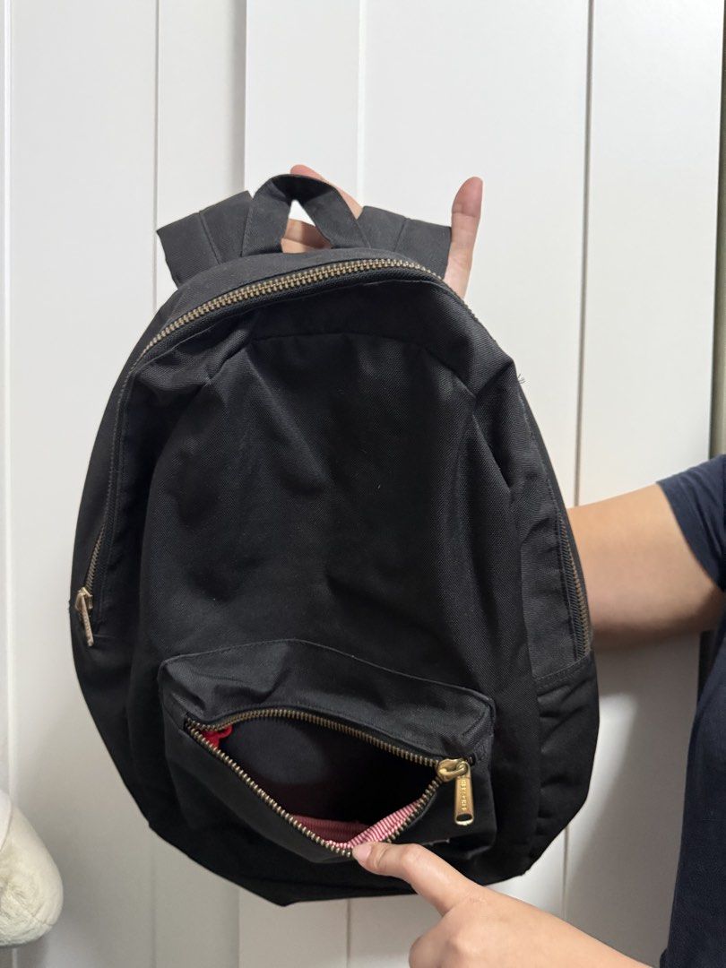 Herschel Black Backpack (Category: Backpacks) located in Cainta. Submitted by jen_cas (Listing ID 1450383879, Image 2). Description: - Classic black Herschel backpack - Durable canvas material - Main compartment with a smaller front zip pocket - Padded shoulder straps for comfort - Ideal for daily use or travel - Simple and functional design - Features gold-tone zippers - payment first before delivery.
