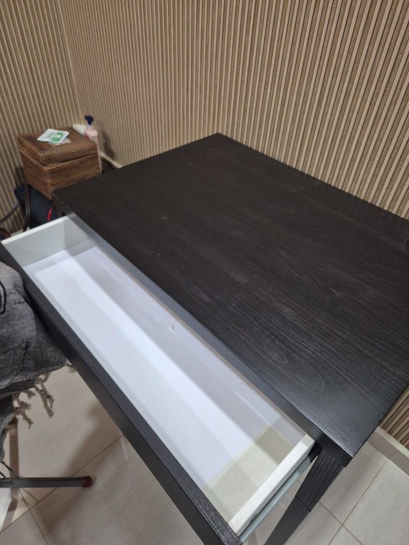 IKEA Computer Table (Category: Tables & Sets) located in Singapore. Submitted by mybmz (Listing ID 1450423917, Image 2). Description: - Ikea computer table - Features a convenient drawer for storage - Includes a side hole, perfect for cable management - Compact design fits perfectly next to sofas or beds.