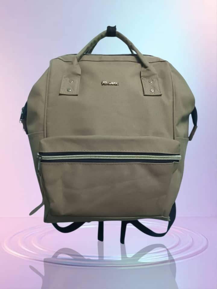 Khaki Backpack with Front Zipper Pocket (Category: Backpacks) located in Bukit Mertajam. Submitted by quicktree.c298c0 (Listing ID 1450408449, Image 1). Description: - Khaki backpack - Main compartment for storage - Front zipper pocket for quick access - Convenient side pockets - Adjustable straps for a comfortable fit - Ideal for everyday use or travel - Spacious interior.