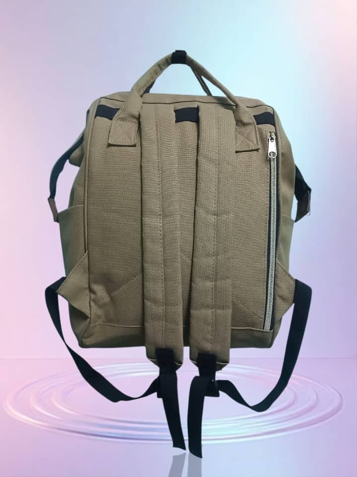Khaki Backpack with Front Zipper Pocket (Category: Backpacks) located in Bukit Mertajam. Submitted by quicktree.c298c0 (Listing ID 1450408449, Image 2). Description: - Khaki backpack - Main compartment for storage - Front zipper pocket for quick access - Convenient side pockets - Adjustable straps for a comfortable fit - Ideal for everyday use or travel - Spacious interior.
