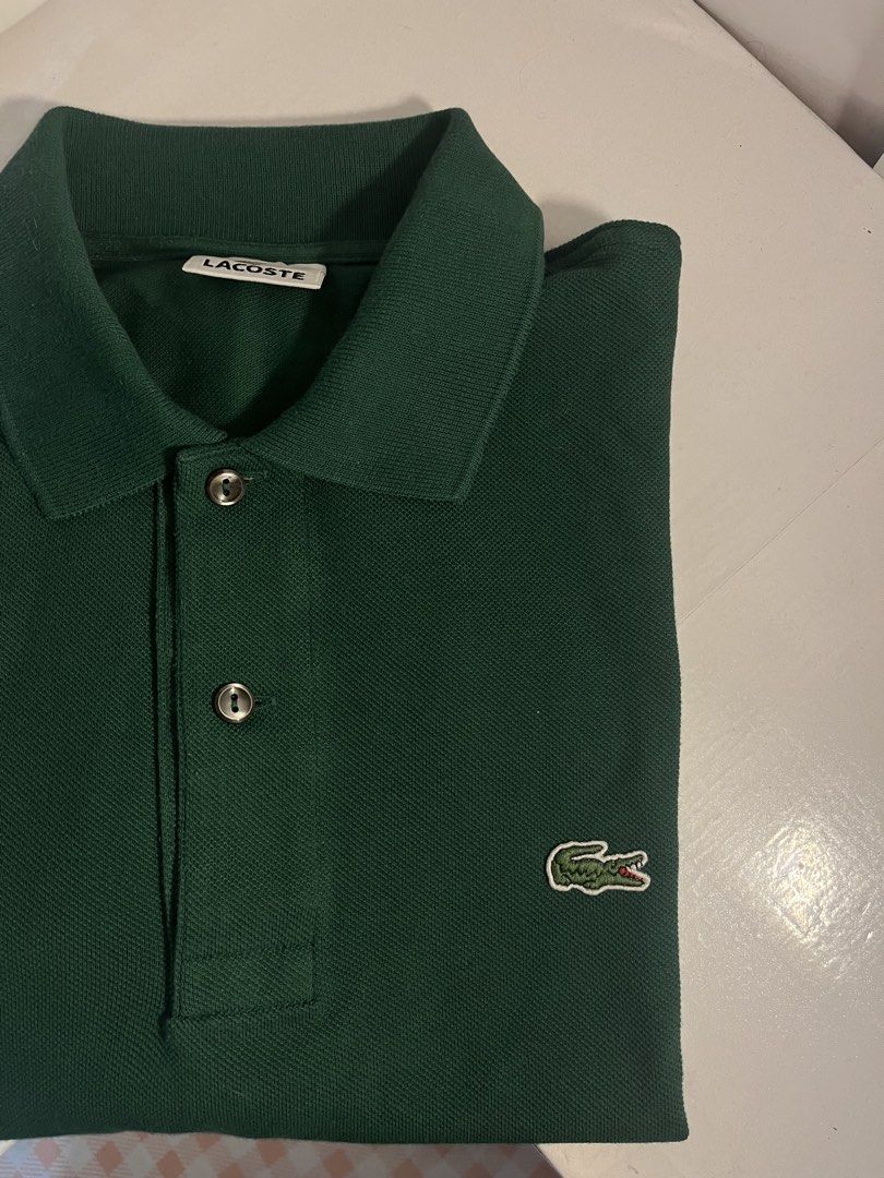 Lacoste Green Polo Shirt Size 4 (Category: Tshirts & Polo Shirts ) located in Muntinlupa City. Submitted by pique.unique (Listing ID 1450486938, Image 2). Description: Lacoste Polo Shirt Pristine Condition Dark Green ColorWay Authenticity Guaranteed No Issue Size Large 22 Widht 28 Lenght Price: 1,700 Free Shipping Fee Location: Muntinlupa City Dm If Interested .