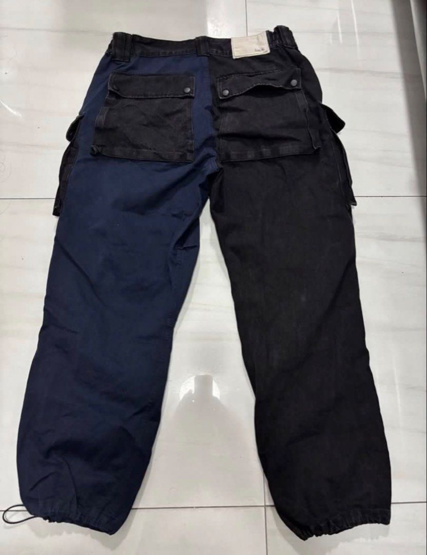 Lakh two tone multipocket cargo denim pants XL (Category: Jeans) located in Quezon City. Submitted by edether (Listing ID 1450446672, Image 2). Description: - LAKH Cargo Pants - Unique colorblock design: one black leg, one navy blue leg - Multiple pockets for ample storage - Elasticated waistband - Elasticated cuffs with drawstrings - Size: XL - Ideal for casual wear 2 tone black and blue XL Waist - 36-37in Length- 41.5in Opening- 9in If you see 