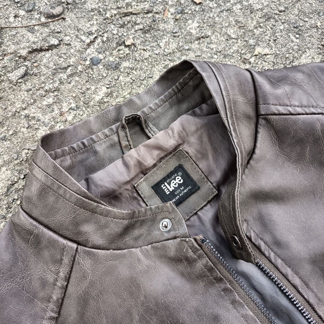 Lee "Mr. Lee" Faux Leather Jacket (Category: Coats, Jackets and Outerwear) located in Caloocan City. Submitted by brightdeer-5fe2 (Listing ID 1450391458, Image 2). Description: - Lee dark brown leather jacket - Zip-up front closure - Two zip pockets on the chest - Two zip pockets on the sides - Snap button collar closure - Lined interior - Versatile for everyday wear or a night out.