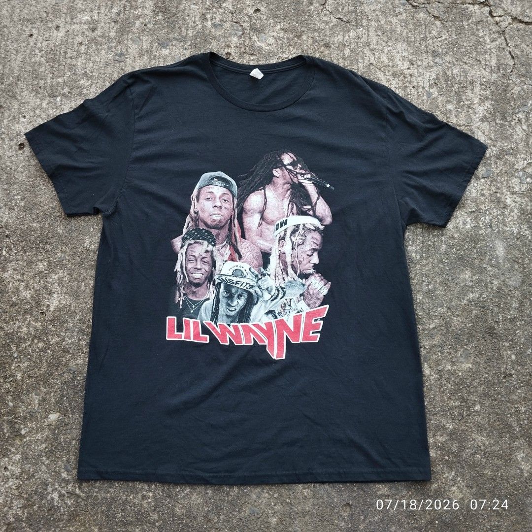 Lil Wayne Graphic T-Shirt XL (Category: Tshirts & Polo Shirts ) located in Aguinaldo. Submitted by oddrabbit_3fd558 (Listing ID 1450320905, Image 1). Description: - Size: XL - Color: Black - Graphic Print: Features multiple images of Lil Wayne on the front and back. - Design Details: Artist's name in red on the front, tour dates on the back. - Brand: Fruit of the Loom - Condition: (Please specify condition if known, e.g., Brand New, Used - Excell