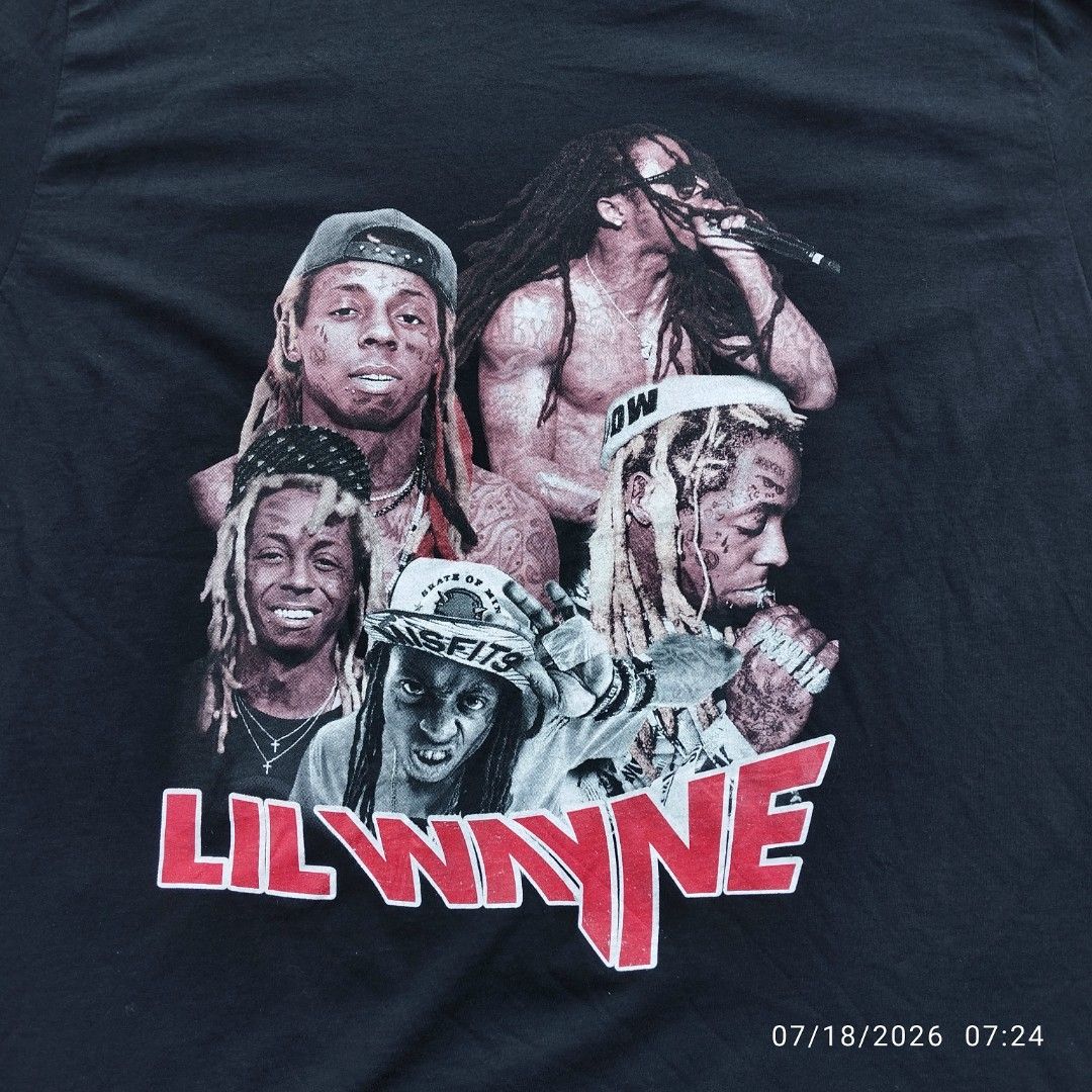 Lil Wayne Graphic T-Shirt XL (Category: Tshirts & Polo Shirts ) located in Aguinaldo. Submitted by oddrabbit_3fd558 (Listing ID 1450320905, Image 3). Description: - Size: XL - Color: Black - Graphic Print: Features multiple images of Lil Wayne on the front and back. - Design Details: Artist's name in red on the front, tour dates on the back. - Brand: Fruit of the Loom - Condition: (Please specify condition if known, e.g., Brand New, Used - Excell