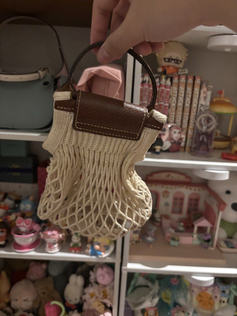 Longchamp Le Pliage Filet Tote Bag (Category: Luxury Bags & Wallets) located in Malolos. Submitted by peonyprincess (Listing ID 1450462170, Image 2). Description: - Cute Longchamp filet tote bag - Beige net with brown leather handles and trim - Ideal for small items or as a fashion accessory - Compact and easy to carry.