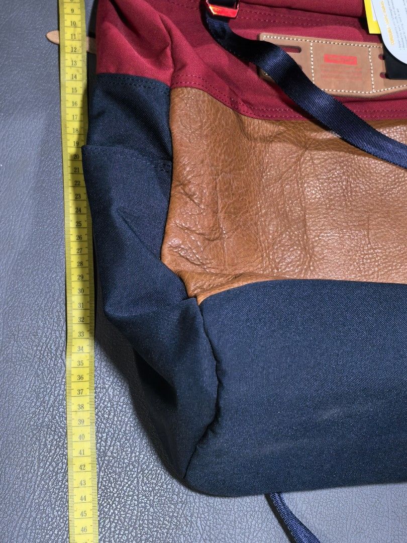 MASTER-PIECE Backpack Red Navy Brown Leather Accents (Category: Backpacks) located in Cagayan de Oro. Submitted by pootx (Listing ID 1450380131, Image 3). Description: - Stylish multi-color backpack from MASTER-PIECE. - Features red, navy, and brown leather details. - Main compartment for storage. - Convenient front zip pocket. - Adjustable straps for a comfortable fit. - Comes with original care instructions. - Ideal for everyday use or travel a