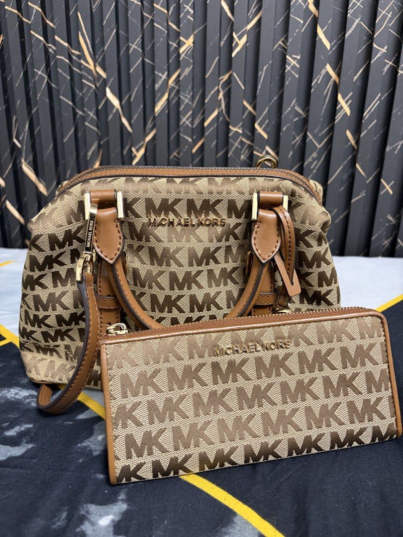 Michael Kors Monogram Handbag and Wallet Set (Category: Luxury Bags & Wallets) located in Quezon City. Submitted by primarosa20 (Listing ID 1450387244, Image 1). Description: - Michael Kors monogram print handbag and matching wallet - Classic brown and tan colorway - Handbag features top handles and a detachable strap - Wallet has multiple card slots and compartments - Ideal set for everyday use.