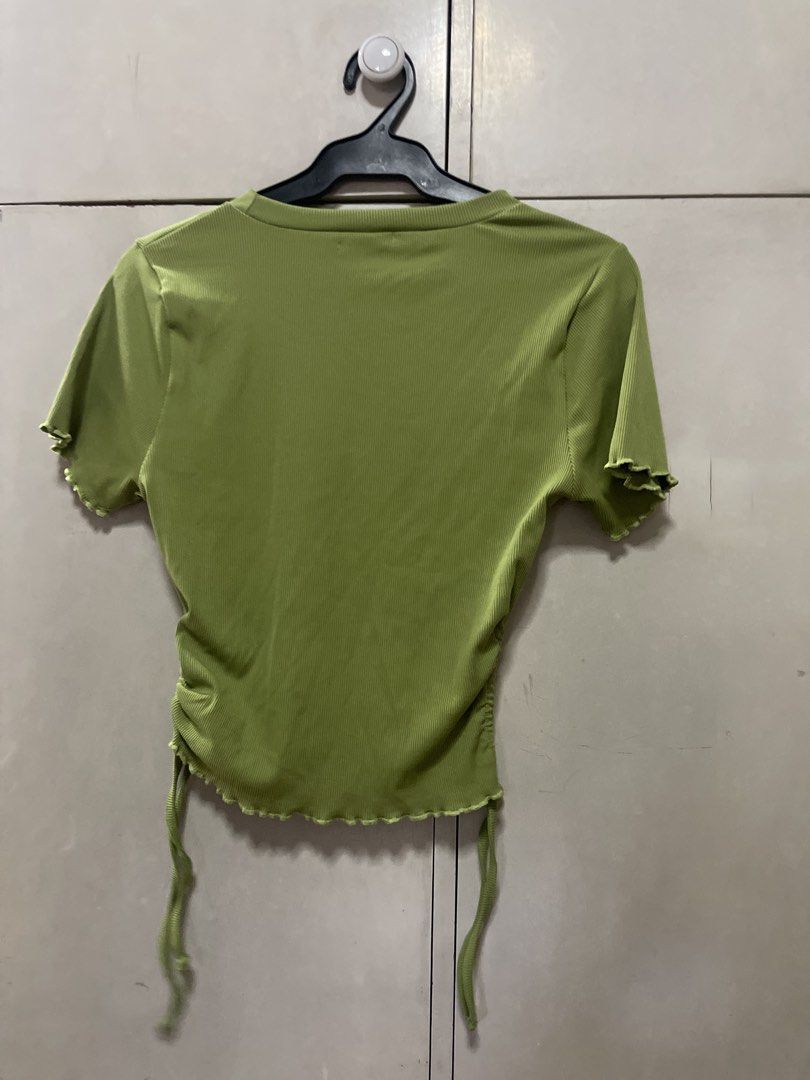 Milkshake Lime Green Ruched Drawstring T-shirt (Category: Shirts) located in Quezon City. Submitted by lespyjamas (Listing ID 1450400691, Image 2). Description: - Brand: Milkshake - Color: Lime Green - Fabric: Ribbed - Details: Lettuce hem on sleeves and bottom, side ruching with adjustable drawstring ties - Neckline: Crew neck - Sleeves: Short sleeves.