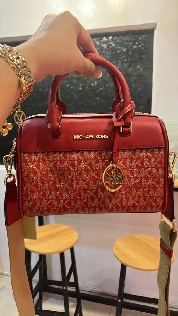 Mk mini duffle (Category: Luxury Bags & Wallets) located in Iloilo. Submitted by kikay_29 (Listing ID 1450387359, Image 1). Description: Original from US Good as new For me it’s lovely as a handbag, with guitar strap sling.