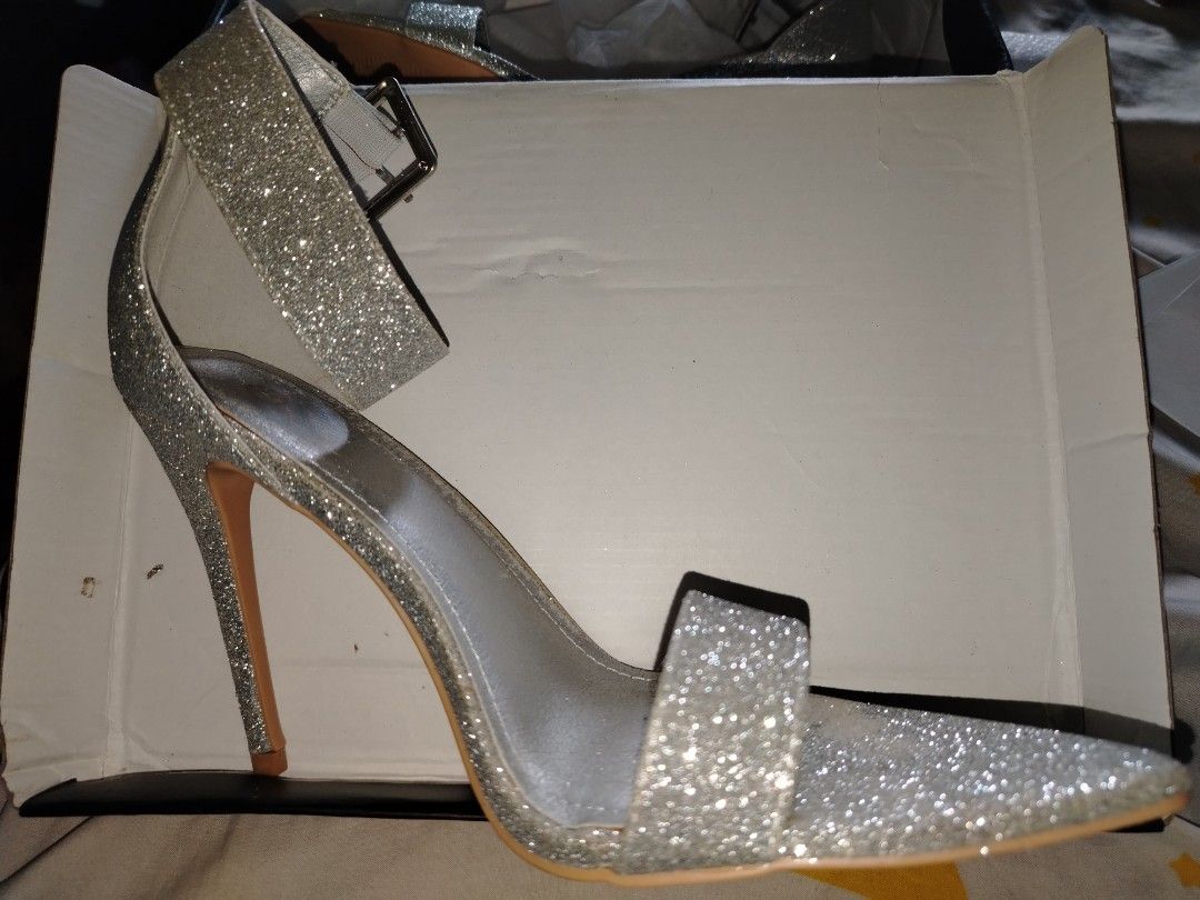 Mysoft Silver Glitter Stiletto Heels with Ankle Strap (Size 7.5) (Category: Heels) located in Taguig. Submitted by fromvenicee (Listing ID 1450352803, Image 1). Description: Condition: Worn once for a prom and never been used since then. Heel Height: 4 inches Perfect For: Prom, weddings, formal evening events, or parties! Comes with its box and dust bag.