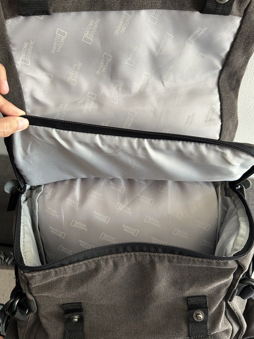 National Geographic Camera Backpack (Category: Backpacks) located in Calamba. Submitted by chwbcca (Listing ID 1450324547, Image 3). Description: - Grey National Geographic canvas backpack - Main compartment with padded dividers for camera gear - Multiple pockets and compartments for organization - Adjustable straps for comfortable carrying - Durable material for long-lasting use - Ideal for photographers and everyday adventures -National Geograp