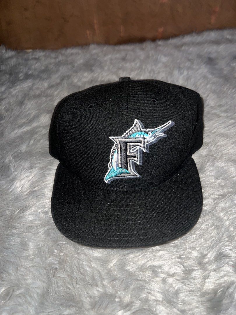 New Era Florida Marlins Fitted Baseball Cap Size 7 1/4 (Category: Caps & Hats) located in Manila. Submitted by jesus.jae (Listing ID 1450495015, Image 1). Description: - Brand: New Era - Style: 59FIFTY Official On-Field Fitted Cap - Team: Florida Marlins - Design: Classic 'F' logo with marlin emblem - Color: Black - Size: 7 1/4 (59.5 CM) - Condition: Brand New - Perfect for: Marlins fans and cap collectors.