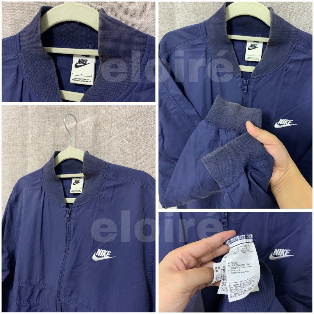 Nike Navy Blue Bomber Jacket (Category: Coats, Jackets and Outerwear) located in Taguig. Submitted by eloire (Listing ID 1450516839, Image 2). Description: Details • Size:22x25 M-L • Condition: • Issue: Fading sa neck and ribbings, need lang talaga ijobus and wash Reminder ⚠️ This is a ukay/preloved item. Please wash before use. ⚠️ Visible issues may be improved or fixed with washing and Jobus. ⚠️ Please check all photos and manage your expectati