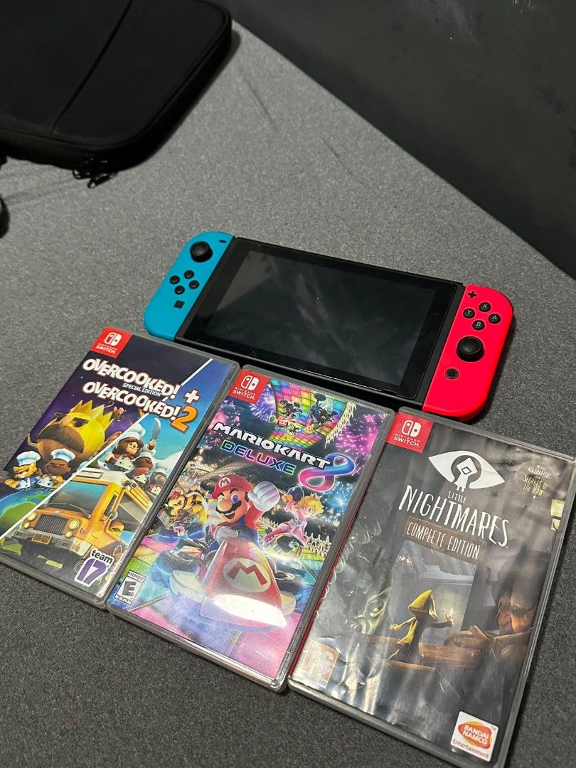 Nintendo Switch Console with Mario Kart, Overcooked, Little Nightmares (Category: Nintendo) located in Manila. Submitted by ryndz7756517 (Listing ID 1450325112, Image 3). Description: Selling a Nintendo Switch console. Comes with three games: Mario Kart 8 Deluxe, Overcooked! All You Can Eat, and Little Nightmares Complete Edition. Joy-Cons are red and blue. Ready for some gaming fun! Dm sa interested Complete accessories, box .