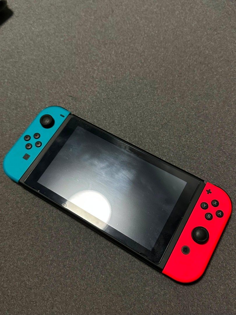 Nintendo Switch Console with Mario Kart, Overcooked, Little Nightmares (Category: Nintendo) located in Manila. Submitted by ryndz7756517 (Listing ID 1450325112, Image 2). Description: Selling a Nintendo Switch console. Comes with three games: Mario Kart 8 Deluxe, Overcooked! All You Can Eat, and Little Nightmares Complete Edition. Joy-Cons are red and blue. Ready for some gaming fun! Dm sa interested Complete accessories, box .