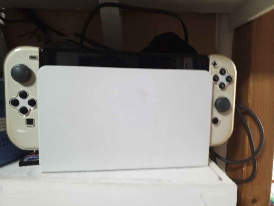 Nintendo Switch OLED Dock - White (Category: Nintendo) located in Manila. Submitted by safeturtle.5318f8 (Listing ID 1450391028, Image 1). Description: - White dock for Nintendo Switch OLED model - Connect your console to your TV - All necessary cables included - Set up your gaming station easily hnd n nagagamit.
