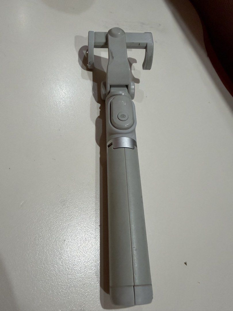 Original Xiaomi Bluetooth Selfie Stick Tripod | USB Rechargeable (Category: Tripods & Monopods) located in Pagsanjan. Submitted by livefalcon_b699f0 (Listing ID 1450368435, Image 1). Description: * Original Xiaomi product * Bluetooth remote shutter included * USB rechargeable (charging cable included) * Extends up to approximately 0.5 meter * Tripod and selfie stick in one * Fully functional * Visible signs of use * One screw cover is missing but