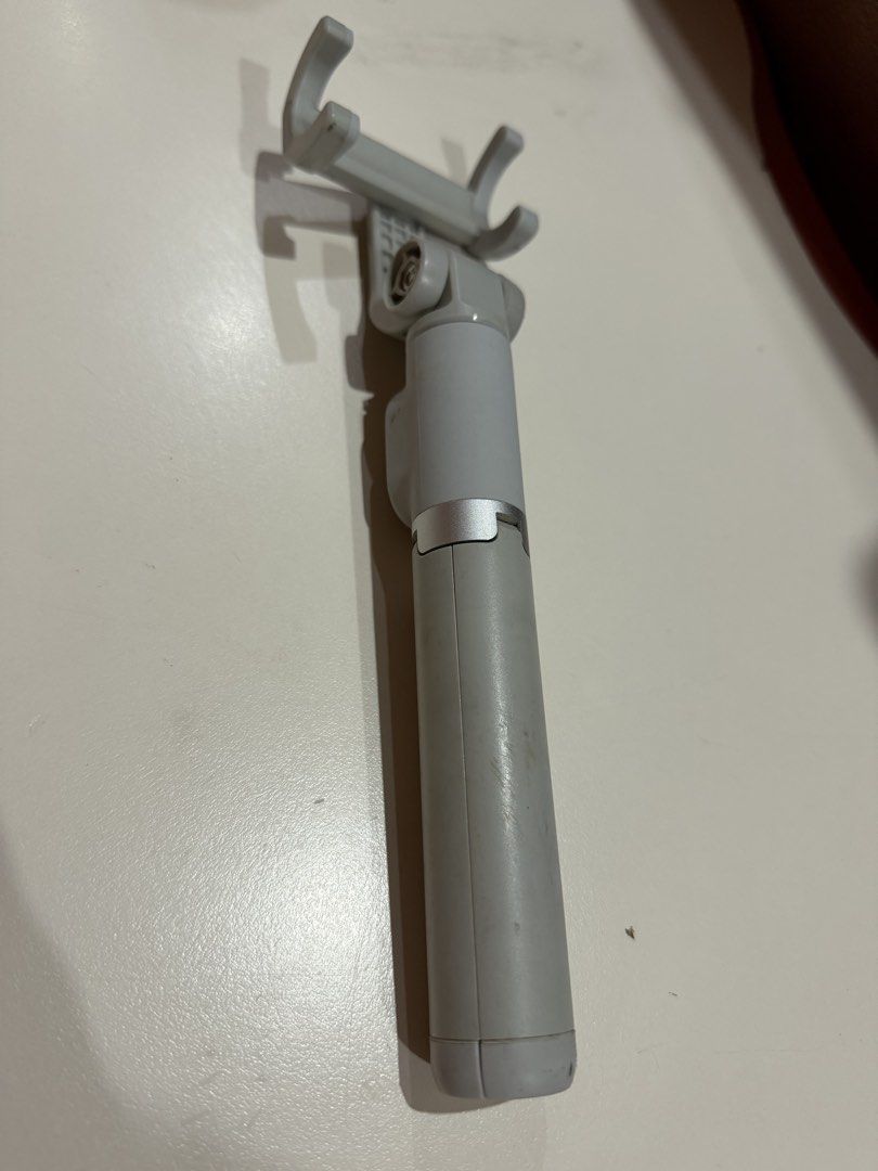 Original Xiaomi Bluetooth Selfie Stick Tripod | USB Rechargeable (Category: Tripods & Monopods) located in Pagsanjan. Submitted by livefalcon_b699f0 (Listing ID 1450368435, Image 2). Description: * Original Xiaomi product * Bluetooth remote shutter included * USB rechargeable (charging cable included) * Extends up to approximately 0.5 meter * Tripod and selfie stick in one * Fully functional * Visible signs of use * One screw cover is missing but