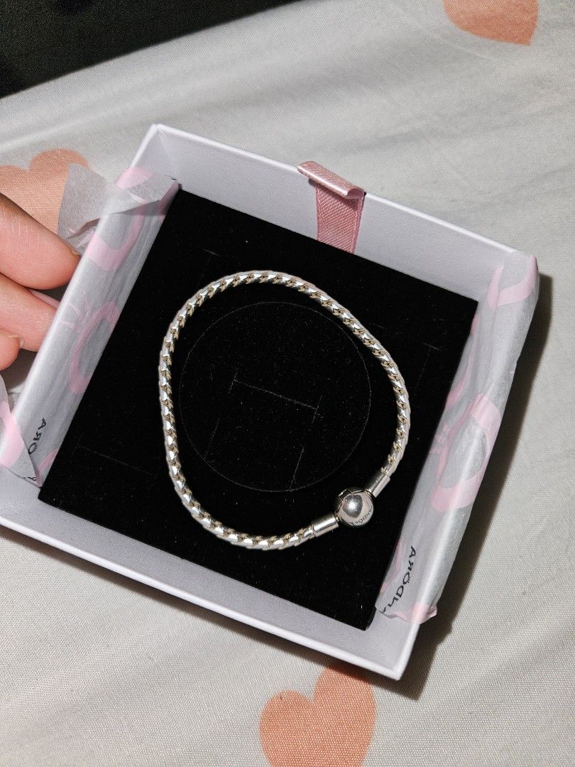 Pandora Sterling Silver Braided Bracelet with Clasp (Category: Bracelets) located in Kuala Lumpur. Submitted by cat_ho3 (Listing ID 1450355788, Image 2). Description: - New bracelet but the wrong size Genuine Pandora Sterling Silver Braided Bracelet - Features the iconic Pandora ball clasp - Elegant twisted rope design - Comes with original Pandora box and receipt - Versatile: Ideal for adding charms or wearing as a standalone piece.