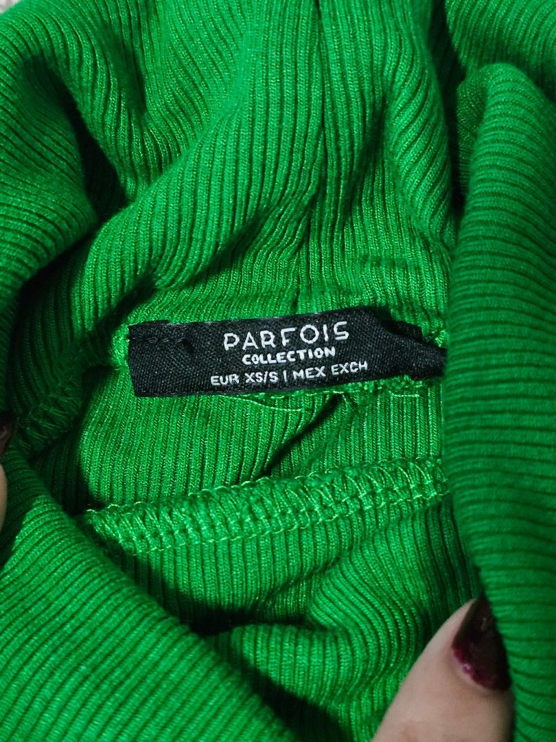 Parfois Collection Green Ribbed Turtleneck Top (Category: Longsleeves) located in Quezon City. Submitted by declutterwithnari (Listing ID 1450339388, Image 3). Description: PARFOIS Ribbed Turtleneck Top - Color: Green - Size: XS/S - In great condition, stretchable material. Might fit semi-M frame. MOP: GCash, GoTyme, Maya (payment first) MOD: Lalamove, Grab, J&T (item + sf) rfs: decluttering.