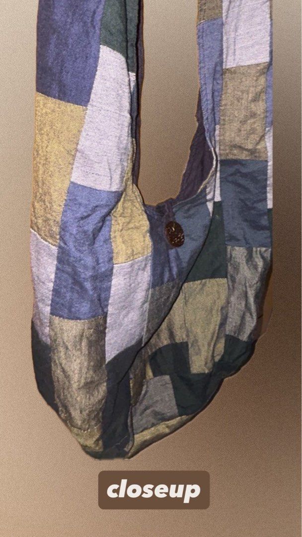 Patchwork Shoulder Bag (Category: Shoulder Bags) located in Singapore. Submitted by mahrazrn (Listing ID 1448989329, Image 2). Description: - Unique patchwork design with varied colors and textures - Secure single button closure - Long, comfortable shoulder strap - Ideal for everyday use -Only used it once Sizing: -Strap drop (top to bag opening): ~45–55 cm -Bag height (body only): ~30–35 cm -Bag width: ~28–35 cm.
