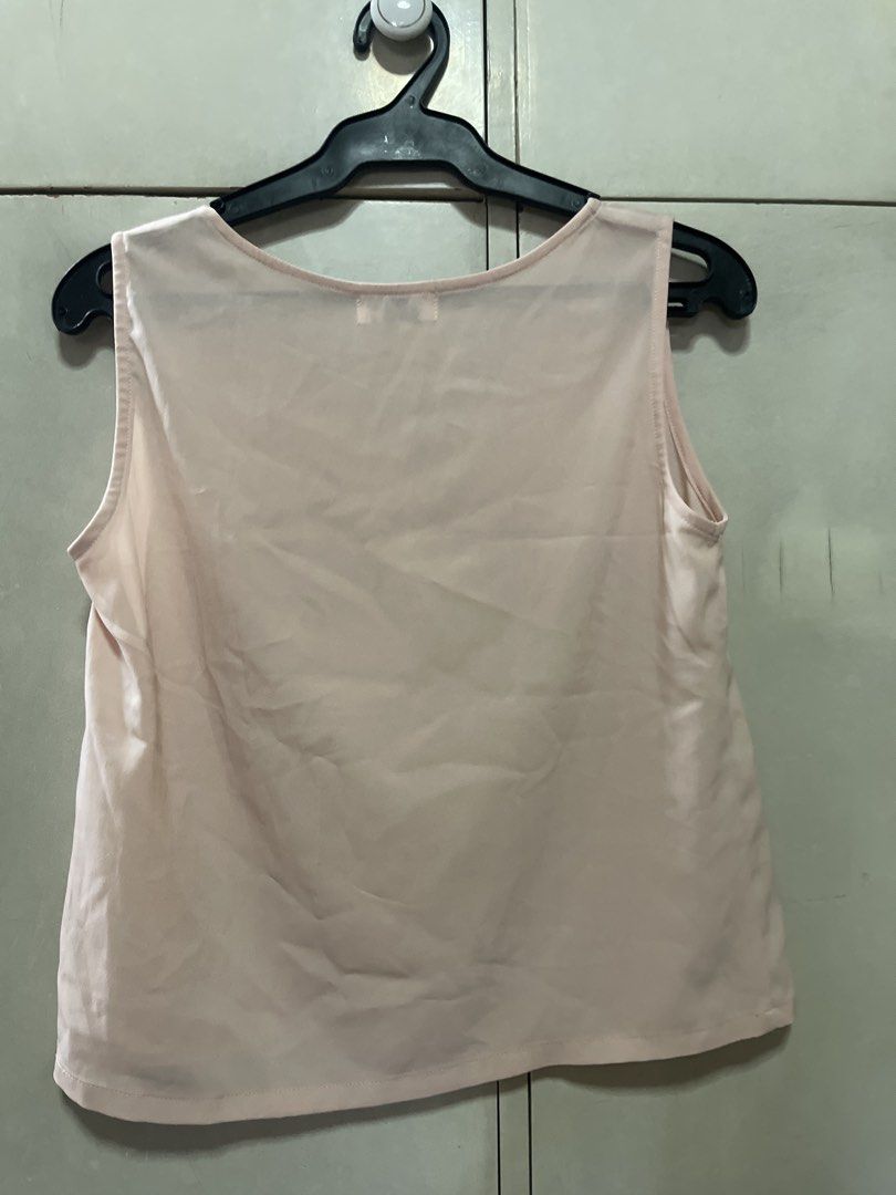 Pink Sleeveless V-Neck Top (Category: Sleeveless) located in Quezon City. Submitted by lespyjamas (Listing ID 1450401351, Image 2). Description: - Simple pink sleeveless top - V-neckline - Perfect basic piece for any wardrobe - Great for layering or wearing on its own - Easily pairs with skirts or pants.