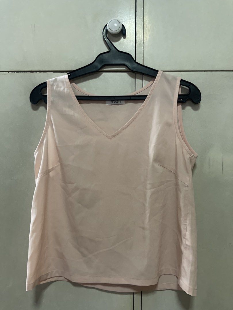Pink Sleeveless V-Neck Top (Category: Sleeveless) located in Quezon City. Submitted by lespyjamas (Listing ID 1450401351, Image 1). Description: - Simple pink sleeveless top - V-neckline - Perfect basic piece for any wardrobe - Great for layering or wearing on its own - Easily pairs with skirts or pants.