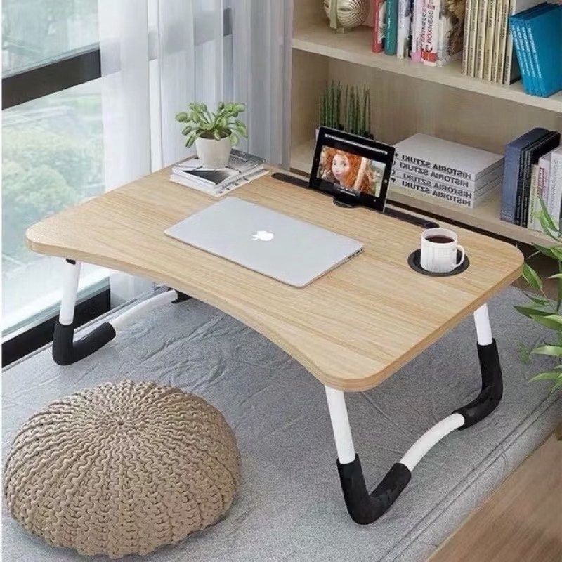 Portable Foldable Laptop Bed Table with Cup Holder (Category: Tables & Sets) located in Balungao. Submitted by janaleyy (Listing ID 1450355463, Image 1). Description: - Convenient foldable laptop table - Perfect for working or studying in bed or on the couch - Features a built-in cup holder - Stylish light wood grain surface - Legs fold flat for easy storage - Lightweight and portable design.