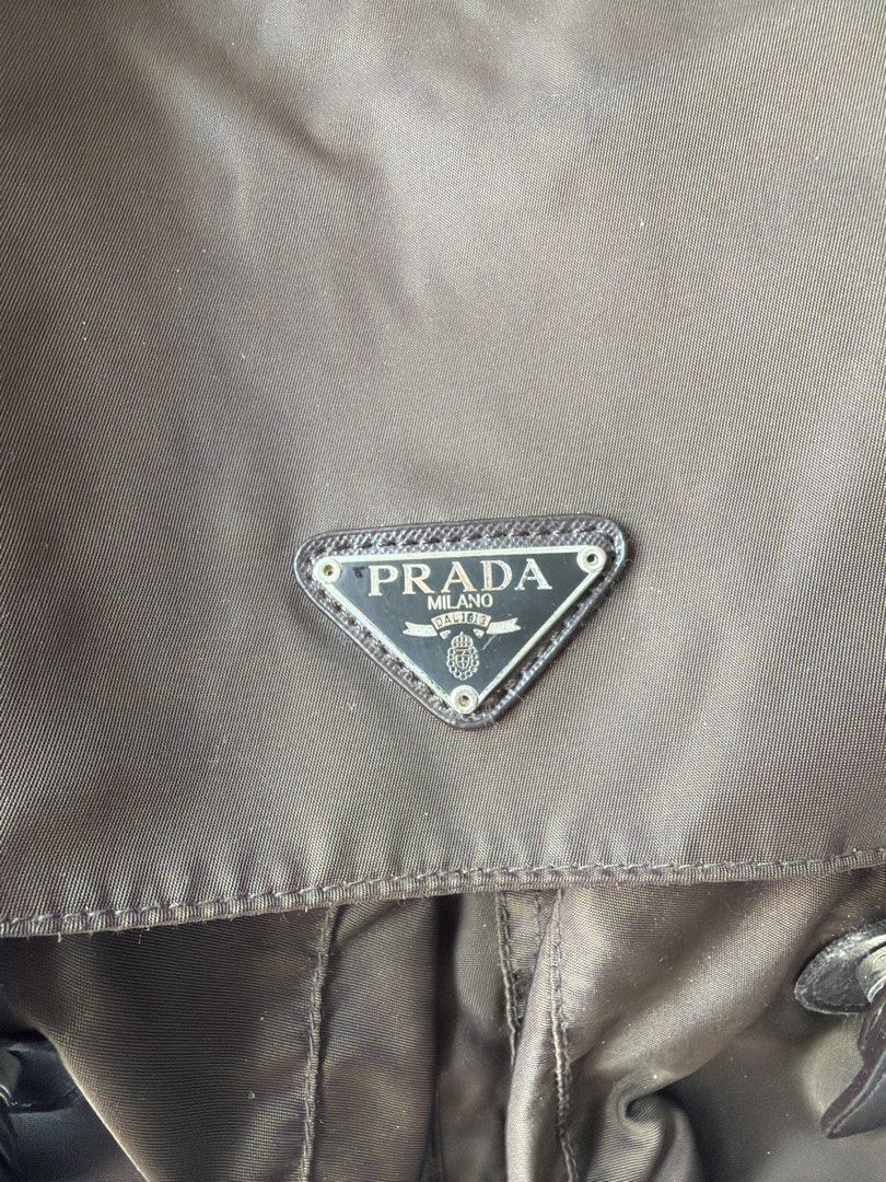 Prada Brown Nylon Messenger Shoulder Bag y2K (Category: Luxury Bags & Wallets) located in Makati City. Submitted by cheapipie (Listing ID 1450330938, Image 2). Description: - NGA Prada bag bought in a vintage store in Upper West Side Manhattan 2009 - Color: Brown - Material: Nylon - Iconic Prada triangle logo - Buckle closures on front flap - Interior zip pocket - Adjustable shoulder strap - Ideal for everyday use.