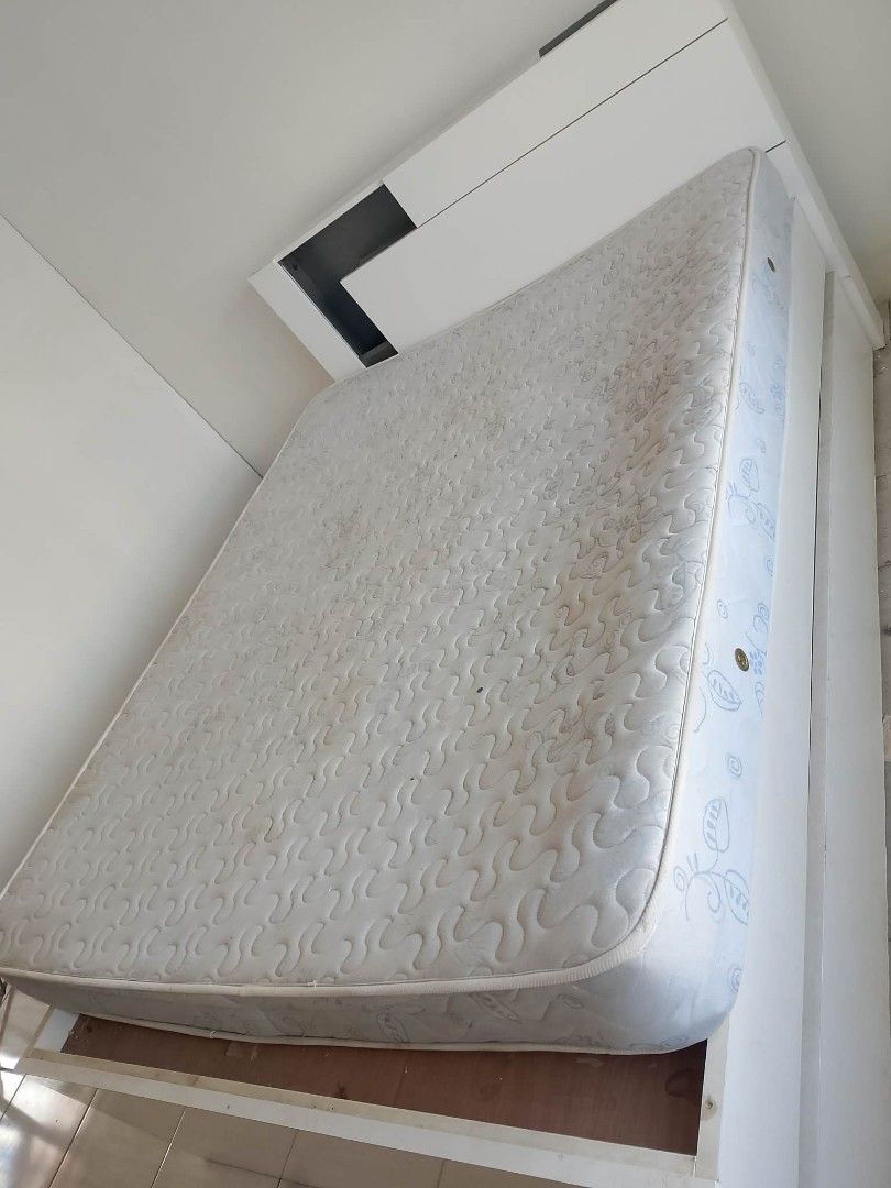 QueenSize White Bed Frame with Storage Drawers and Mattress (Category: Bed Frames & Mattresses) located in Rodriguez. Submitted by amara0914 (Listing ID 1450427217, Image 2). Description: - White bed frame with built-in storage drawers - Includes mattress with patterned cover - Space-saving design, ideal for smaller rooms or apartments - Deep drawers for ample storage - Easy-access storage solutions.