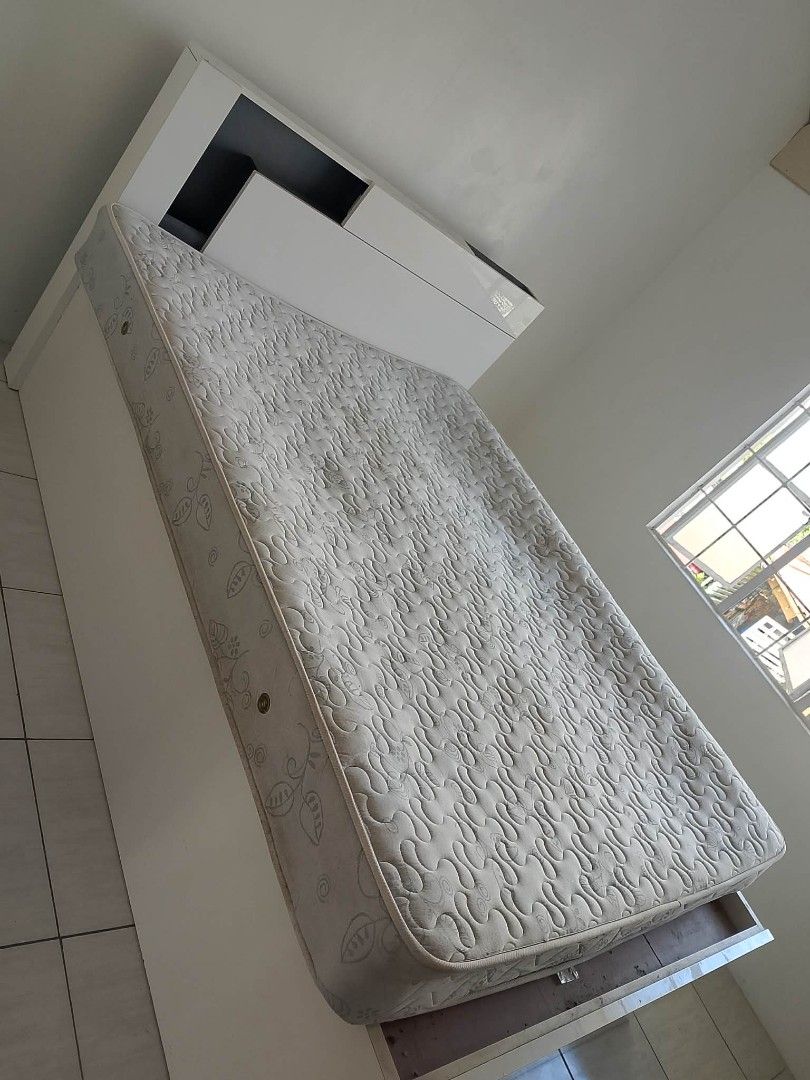 QueenSize White Bed Frame with Storage Drawers and Mattress (Category: Bed Frames & Mattresses) located in Rodriguez. Submitted by amara0914 (Listing ID 1450427217, Image 3). Description: - White bed frame with built-in storage drawers - Includes mattress with patterned cover - Space-saving design, ideal for smaller rooms or apartments - Deep drawers for ample storage - Easy-access storage solutions.
