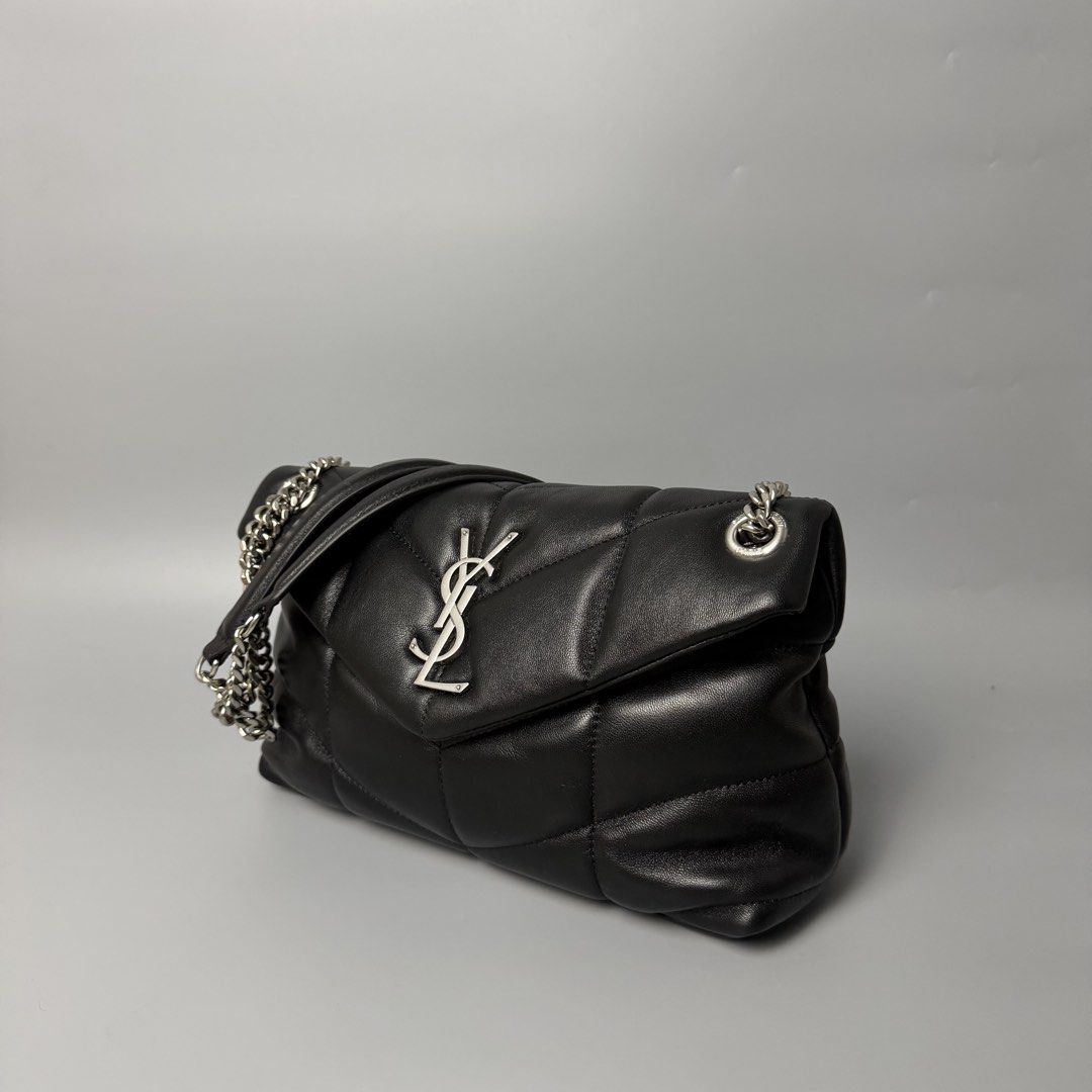 Saint Laurent Black Leather Puffer Shoulder Bag (Category: Luxury Bags & Wallets) located in Malasiqui. Submitted by fosh0fosh0 (Listing ID 1450335978, Image 3). Description: - Authentic Yves Saint Laurent (YSL) Puffer Bag - Material: Black Leather - Hardware: Silver Chain Strap - Design: Classic Quilted Pattern - Versatile: Ideal for both daytime and evening use - Interior: Spacious with a clean lining - Includes: Original dustbag.