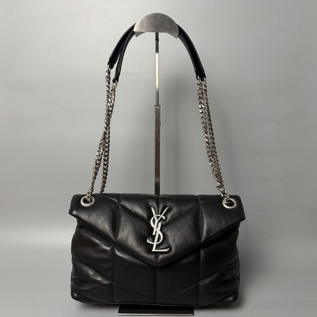 Saint Laurent Black Leather Puffer Shoulder Bag (Category: Luxury Bags & Wallets) located in Malasiqui. Submitted by fosh0fosh0 (Listing ID 1450335978, Image 1). Description: - Authentic Yves Saint Laurent (YSL) Puffer Bag - Material: Black Leather - Hardware: Silver Chain Strap - Design: Classic Quilted Pattern - Versatile: Ideal for both daytime and evening use - Interior: Spacious with a clean lining - Includes: Original dustbag.