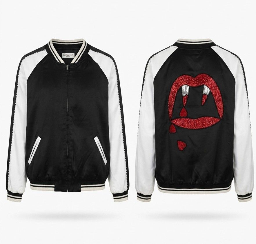 Saint Laurent Black White Bloodluster Bomber Jacket (Category: Coats, Jackets and Outerwear) located in Quezon City. Submitted by phoejay (Listing ID 1450427796, Image 1). Description: - Iconic Saint Laurent bomber jacket - Black body with contrasting white sleeves - Striking sparkly red vampire lips graphic with dripping blood detail on the back - Classic ribbed collar, cuffs, and hem - Full zipper closure - Two convenient front pockets - Guaran
