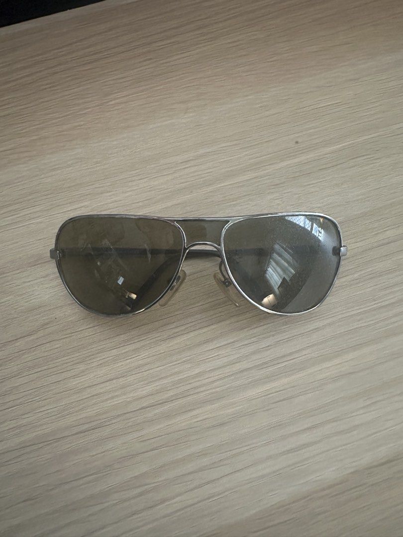 Salvatore Ferragamo Aviator Sunglasses (Category: Sunglasses & Eyewear) located in Quezon City. Submitted by heiressofpersia80 (Listing ID 1450351810, Image 1). Description: - Authentic Salvatore Ferragamo aviator sunglasses - Sleek silver frame - Dark tinted lenses for a classic look - Ideal for everyday wear Unisex Authentic pair of vintage S@lv@tore Ferr@gamo Model Number: 1094 Color Code: 502/73 metallic silver frame paired with Green or dark