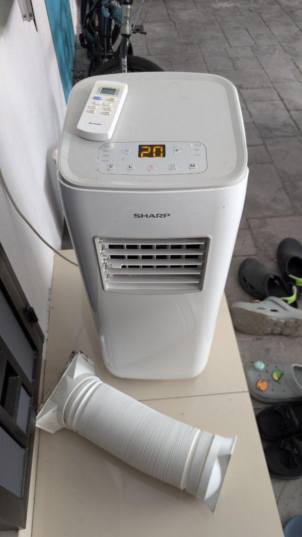 Sharp Portable Air Conditioner with Remote and Hose (Category: Air Conditioners & Heating) located in Bukit Mertajam. Submitted by haz76 (Listing ID 1450376574, Image 1). Description: - White Sharp portable air conditioner - Digital display showing 20 degrees - Includes remote control - Comes with exhaust hose - Excellent for cooling down rooms - In good working condition.