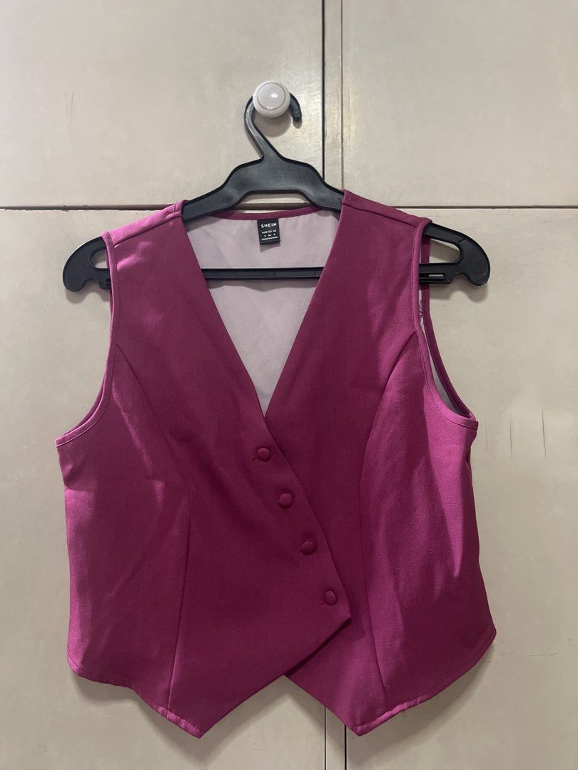 SHEIN Pink Button Front Cropped Vest (Category: Sleeveless) located in Quezon City. Submitted by lespyjamas (Listing ID 1450399636, Image 1). Description: - SHEIN pink cropped vest - Button front closure - Cropped length - Material has a slight sheen - Ideal for layering - Great for dressing up an outfit - Please check photos for exact appearance.