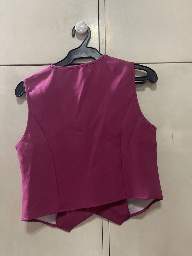 SHEIN Pink Button Front Cropped Vest (Category: Sleeveless) located in Quezon City. Submitted by lespyjamas (Listing ID 1450399636, Image 2). Description: - SHEIN pink cropped vest - Button front closure - Cropped length - Material has a slight sheen - Ideal for layering - Great for dressing up an outfit - Please check photos for exact appearance.