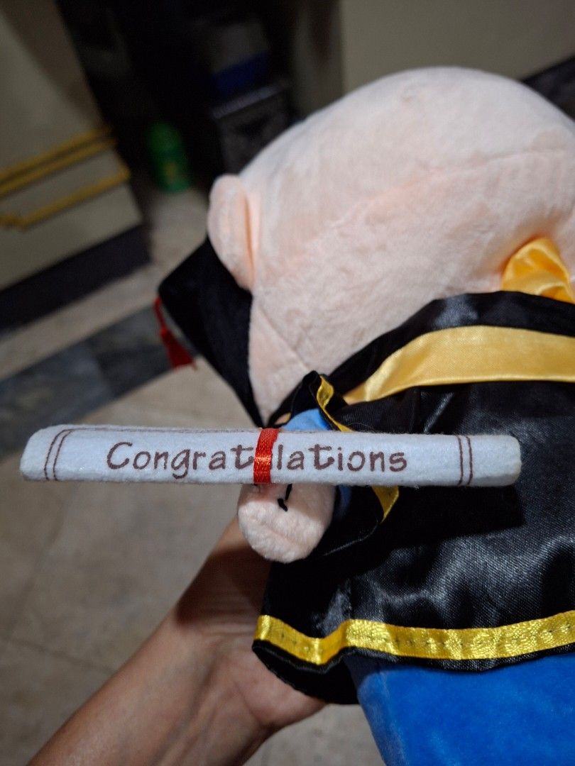 Shin Chan Graduation Plush Toy (Category: Plushies & Soft Toys) located in Quezon City. Submitted by pure_trinsky (Listing ID 1450479556, Image 2). Description: - Adorable graduation plush toy - Features a graduation gown and cap - Includes a 'Congratulations' scroll - Brand: YUENHE - Ideal gift for any graduate.