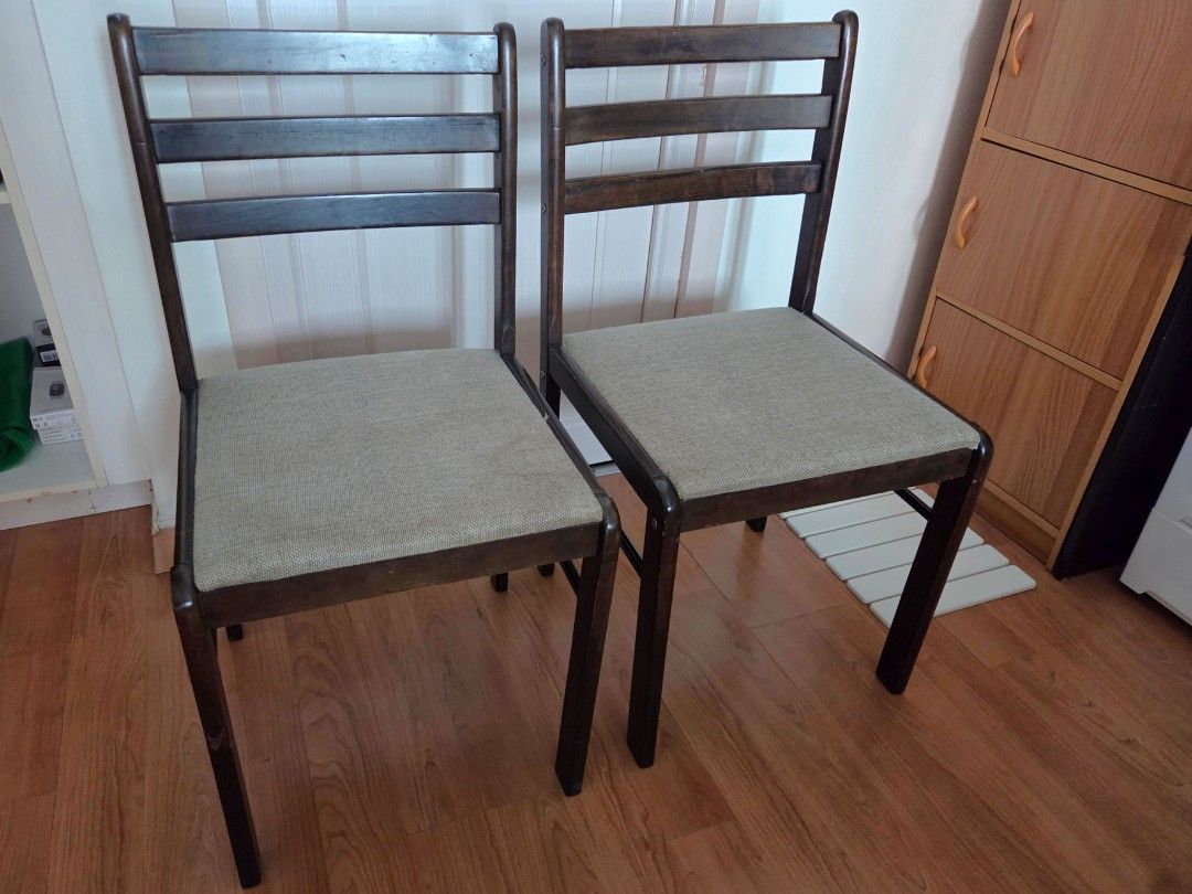 Solid Wood Dining Chairs with Upholstered Seats (Category: Chairs) located in Makati City. Submitted by shoppreloved_ (Listing ID 1450391629, Image 1). Description: - Set of 2 solid wood dining chairs - Dark wood frames - Beige upholstered seats - Slatted backrests - Versatile: use as dining or accent chairs - Made in Malaysia (came with my dining set) - No flaws except maybe for a few scratches here and there rfs: upgrading for pickup in Makati 