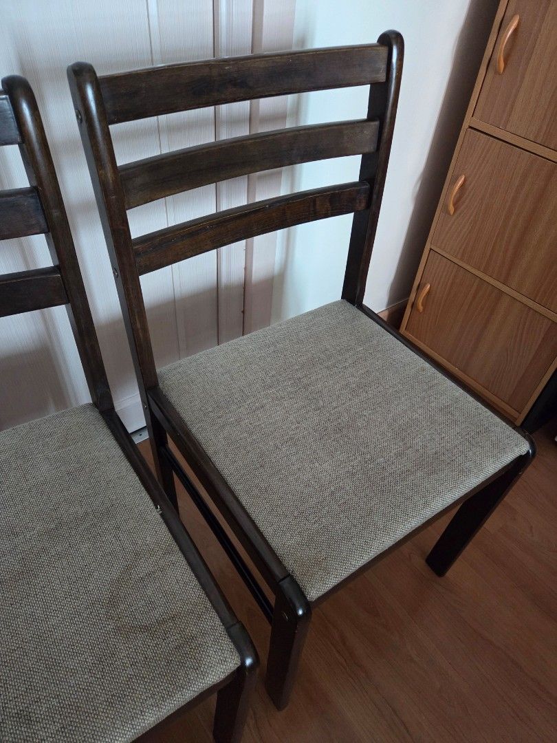Solid Wood Dining Chairs with Upholstered Seats (Category: Chairs) located in Makati City. Submitted by shoppreloved_ (Listing ID 1450391629, Image 3). Description: - Set of 2 solid wood dining chairs - Dark wood frames - Beige upholstered seats - Slatted backrests - Versatile: use as dining or accent chairs - Made in Malaysia (came with my dining set) - No flaws except maybe for a few scratches here and there rfs: upgrading for pickup in Makati 