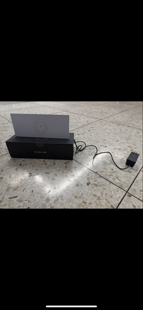Starlink Router with Power Adapter and Box (Category: Networking) located in Quezon City. Submitted by fierceshark_607f81 (Listing ID 1450507944, Image 2). Description: - Starlink Router included - Power adapter - Original packaging - Alignment sheet - Everything needed for setup - Ready for a new home - Save 50% off from msrp.